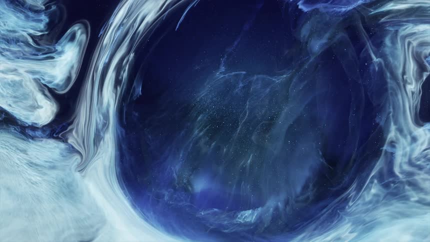 Expanding blob of shimmering bright electric blue liquid ink