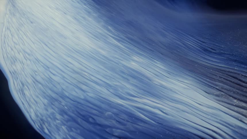 Shimmering liquid streams of blue and white against black