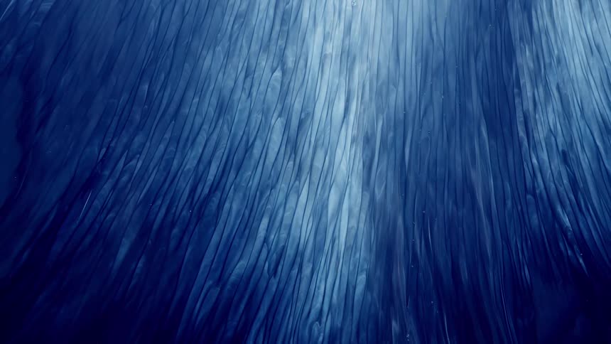 Flowing upward streaks of blue and white ink