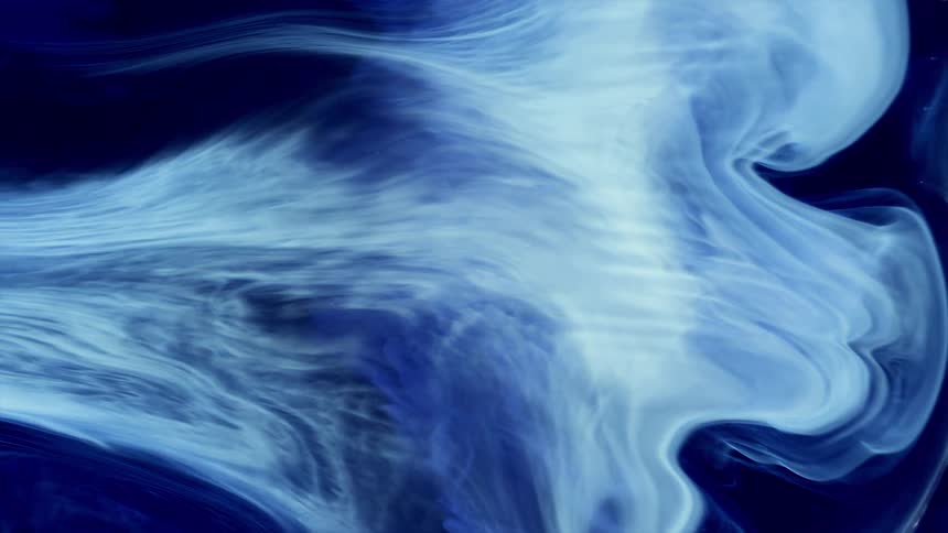 a white and shiny liquid enters the frame and spreads across