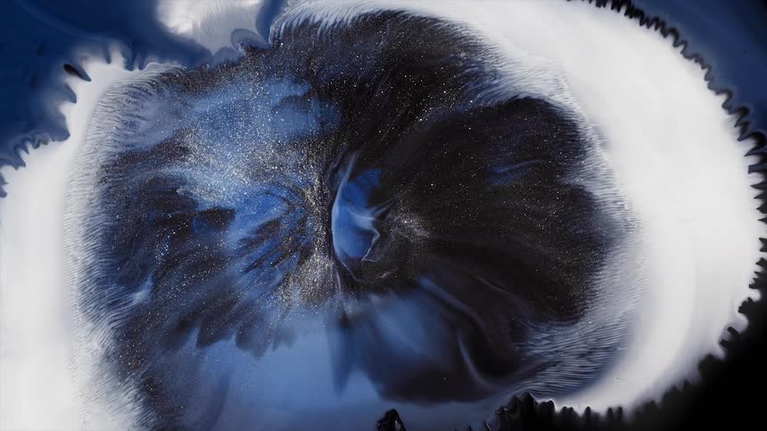 Blue and black colors burst and combine with a white fluid