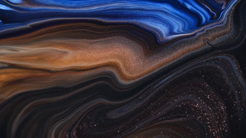 Moving waves and flowing streaks of colorful gold electric blue shimmering liquid ink