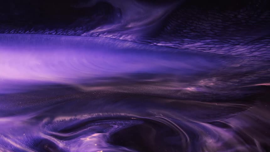 Flowing blobs and waves of shimmering blue purple electric and black ink