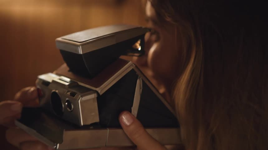 A woman taking a photo with a camera