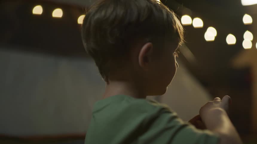 Young boy eats a treat with his fingers