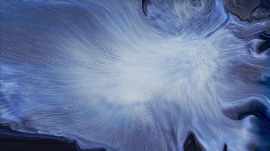 Bright white expands from center spreading tendrils through background of black and blue swirls