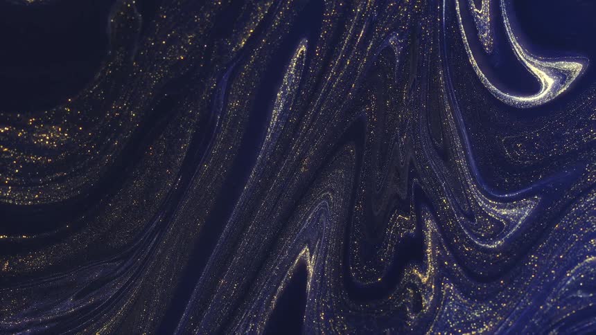 A startrail of golden and metallic ink moving towards the sky