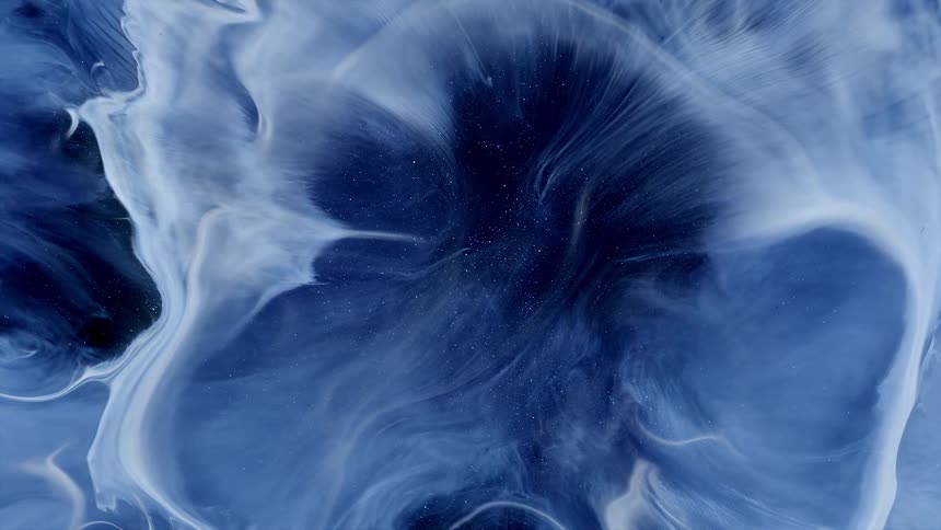 White streams burst and expand against blue