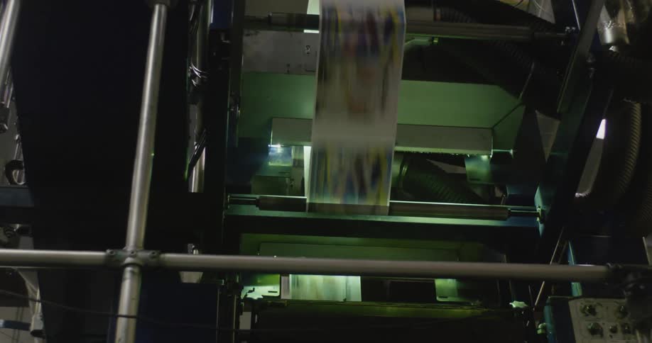 A close up of a factory machine for paper