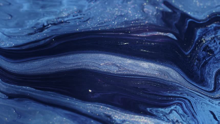 A close up of liquids with sparkles