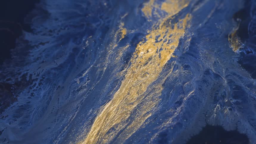 Black blue gold and white colors that look like ice and sand