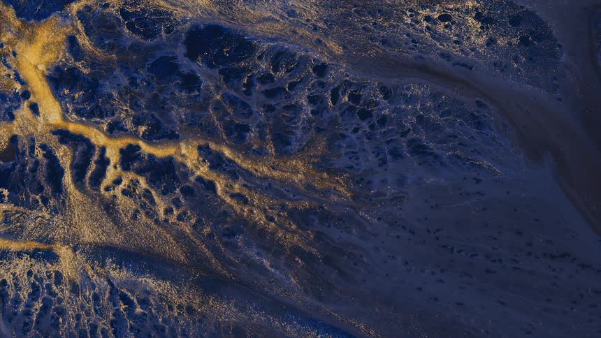 A view of water and sand flowing through capillaries