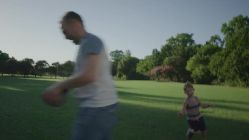 Father and son playing in a park