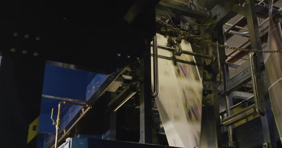 Working printing press for newspaper inside a warehouse