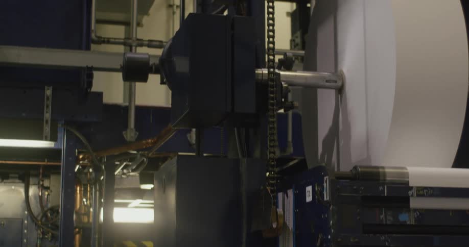 A view of paper on giant rolls in a factory