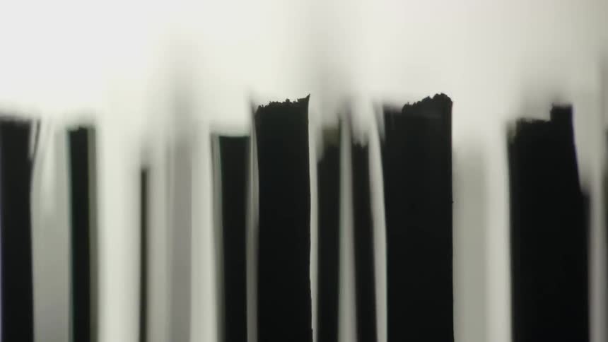 Rows of paper move forward in a blurry area