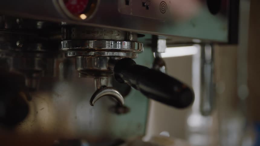 An espresso machine sits in a coffee house
