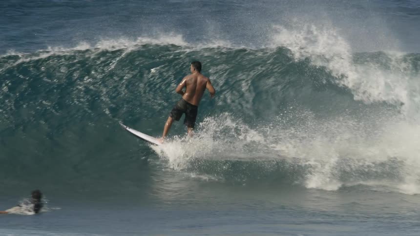 A man surfing on a wave