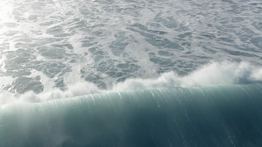 An ocean wave breaks in Hawaii