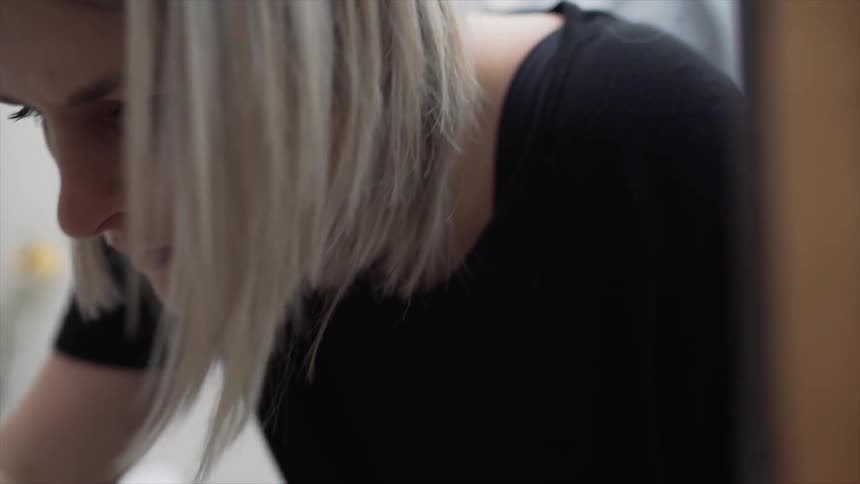 A woman concentrates on her task