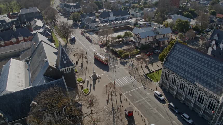 Vehicles and pedestrians on the streets of a small town