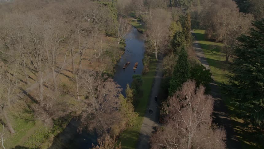 People kayak down a winding river
