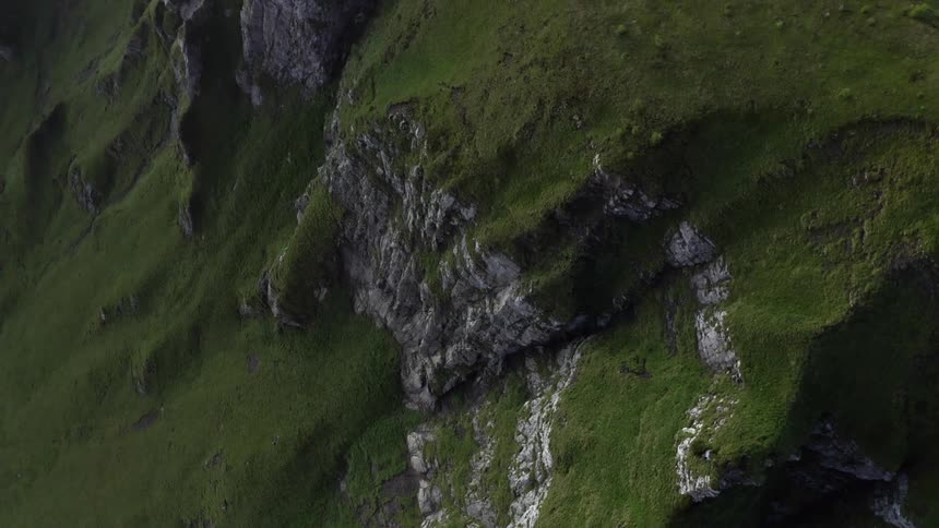 Aerial view of grass covered mountain