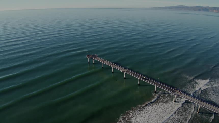 A view of a pier going out into the ocean