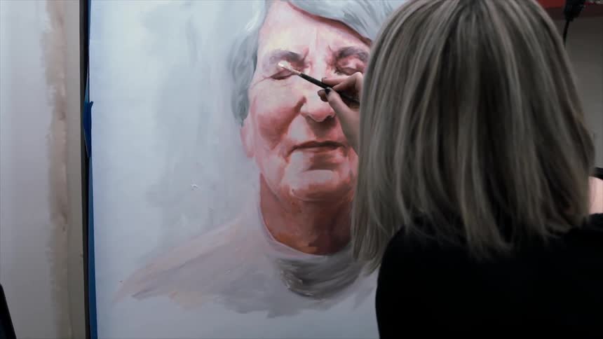 A woman is painting