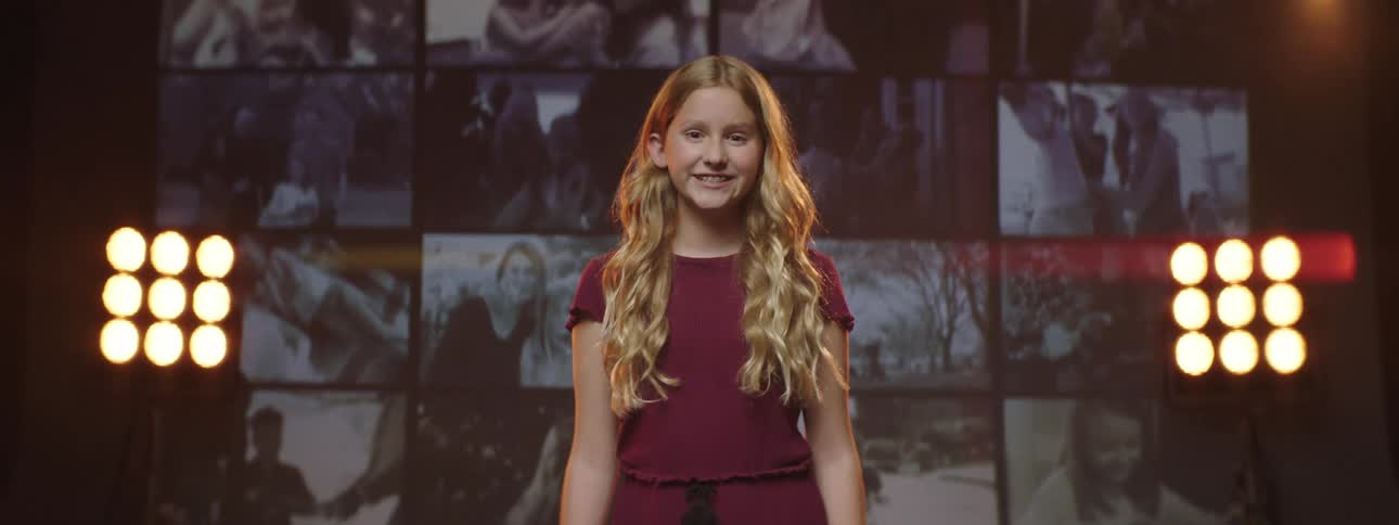 A child standing on a stage