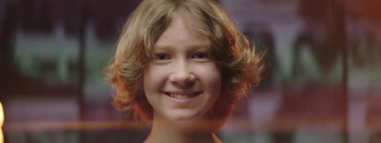 A portrait of a child on a stage