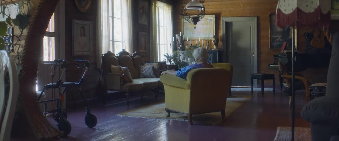 A woman sitting in a chair relaxing