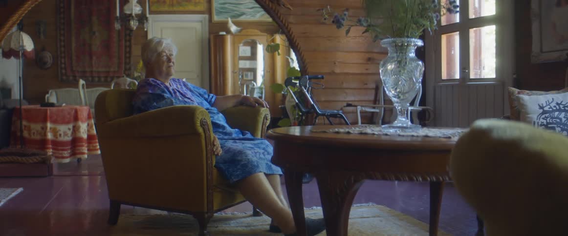 A woman is relaxing in her living room