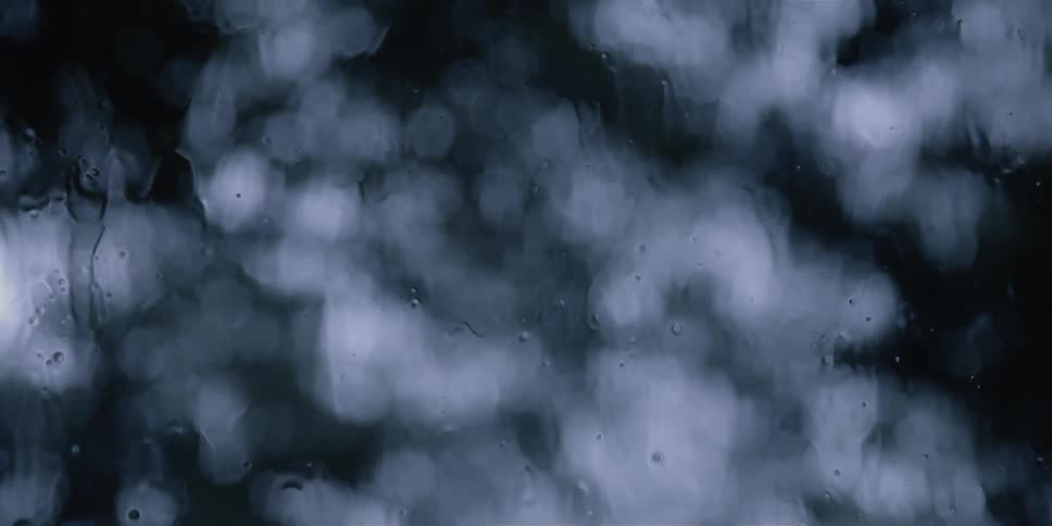 A close up of rain on a window