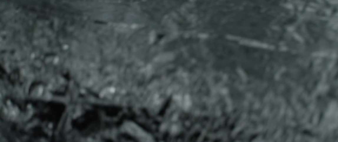 Close Up and abstract shot of a tin foil-like material waving and wrinkling