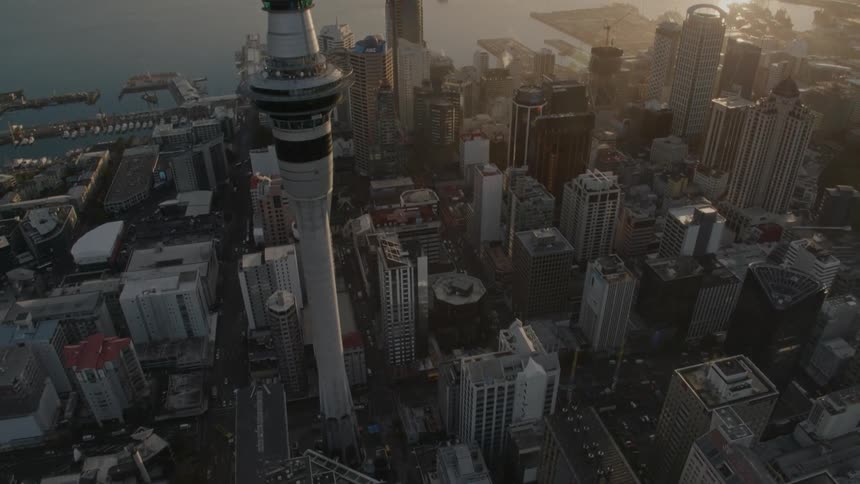 A city skyline with buildings and skyscrapers with the sky and clouds in the background