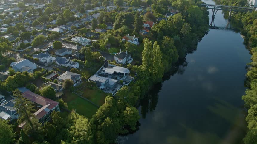 Aerial view of city houses and buildings next to river