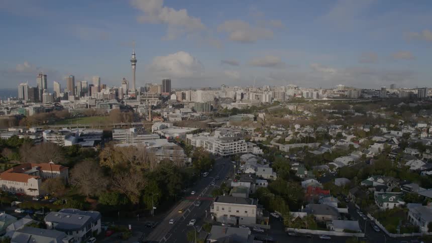 Aerial view of city skyline with highways and vehicles traveling