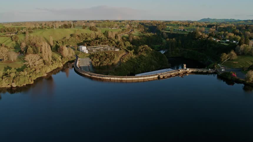 An aerial view of a lake with hydro dam