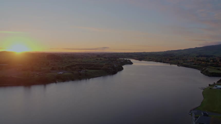 An aerial view of a river running near some land