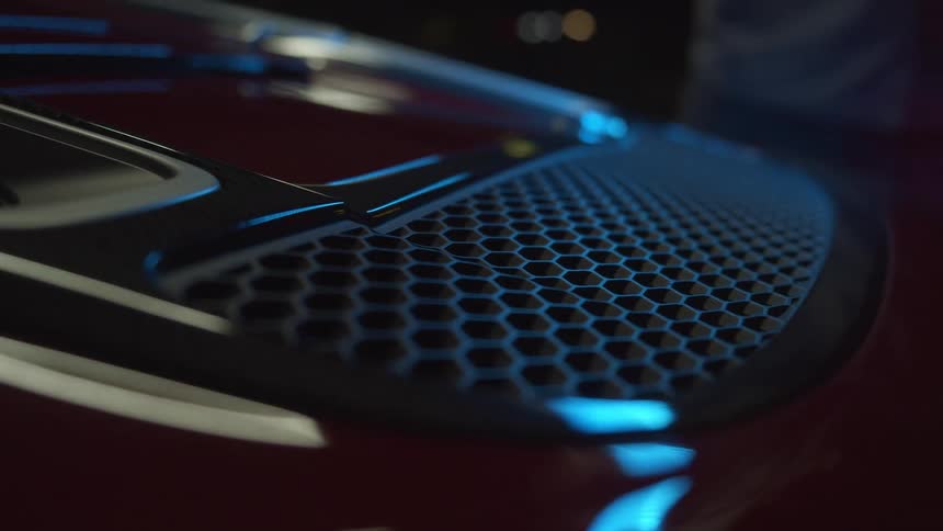 Hood and grill of a black sports car