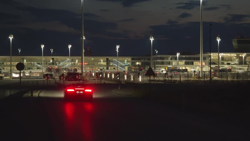 A car driving towards an airport