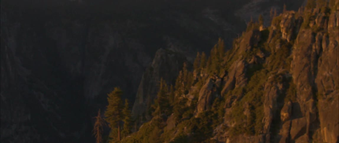 A view of a canyon from the top of it
