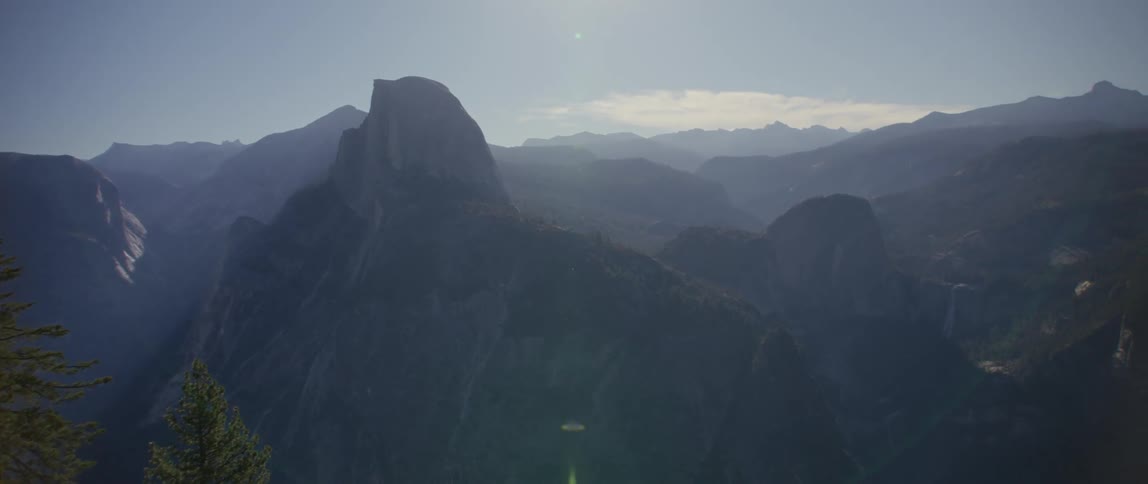 Mountain range and peaks high in a hazy sky
