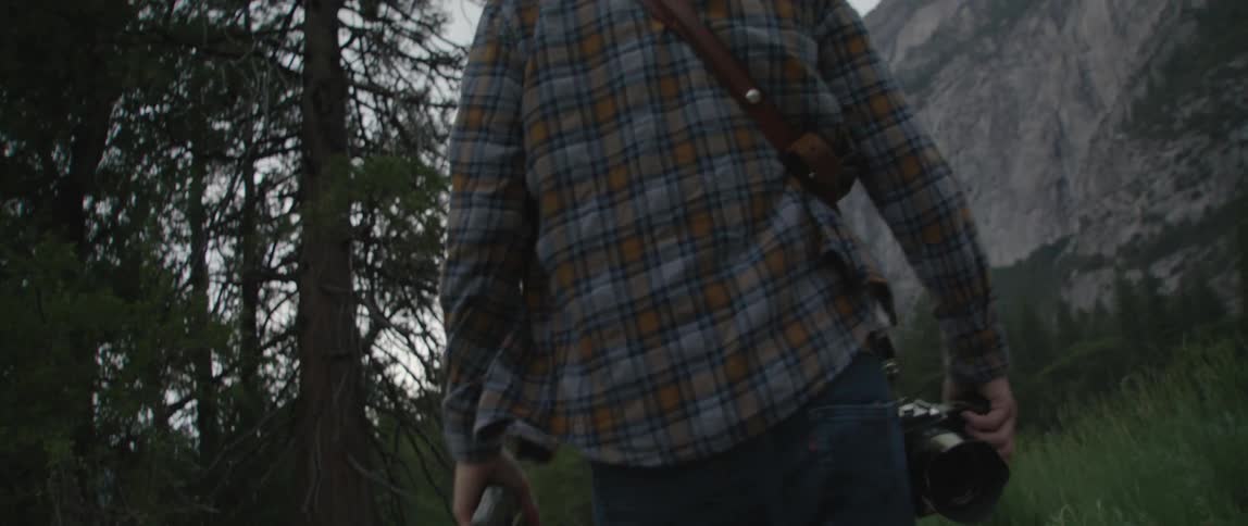 A man hiking outdoors in a forest