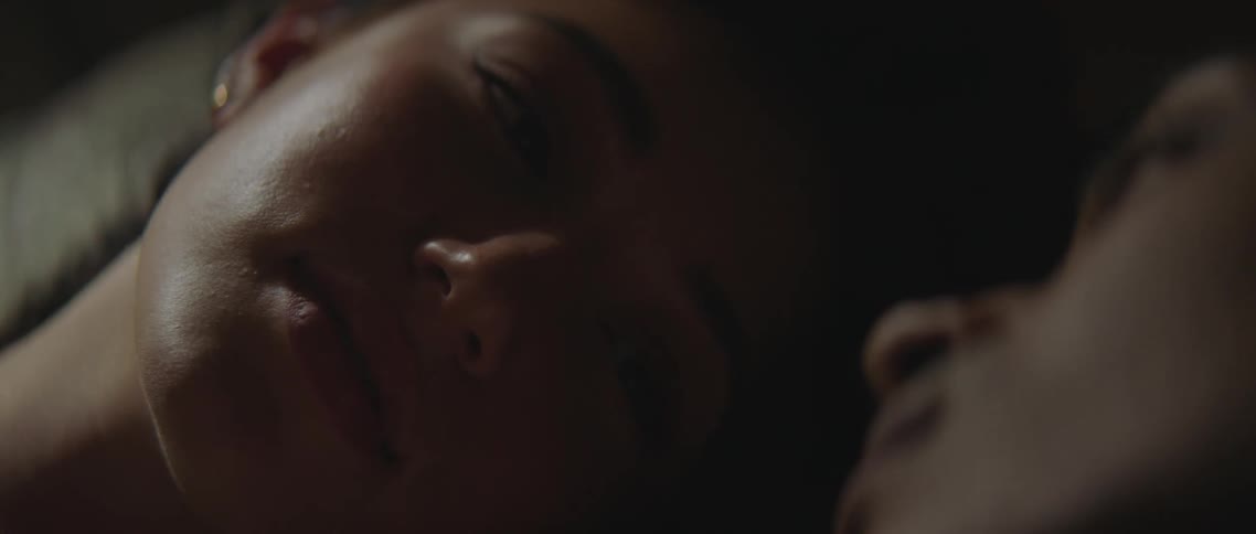 A woman laying in a bed sleeping