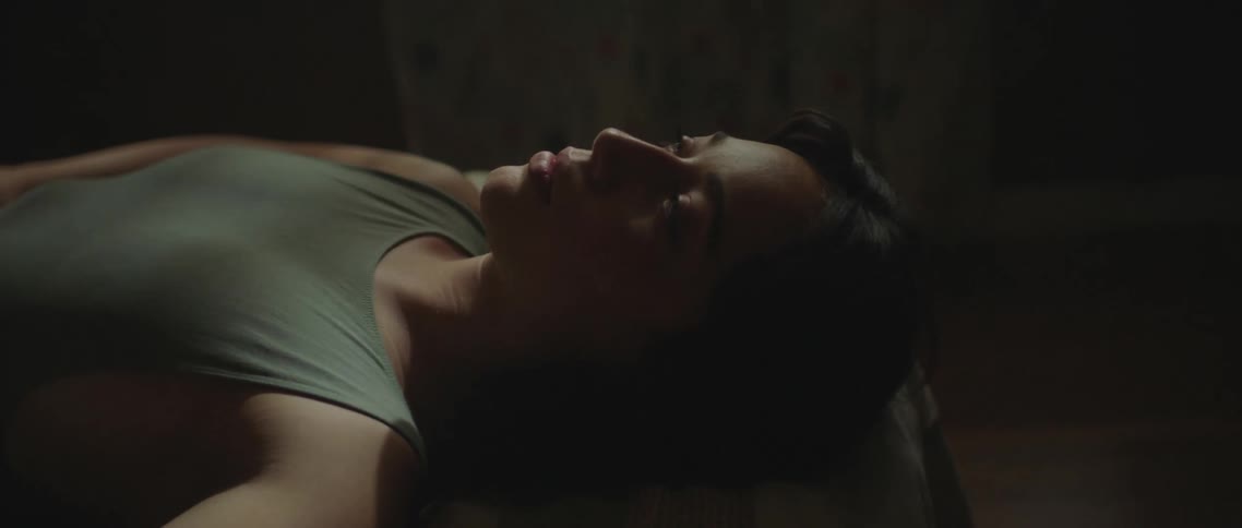 A woman is resting in bed