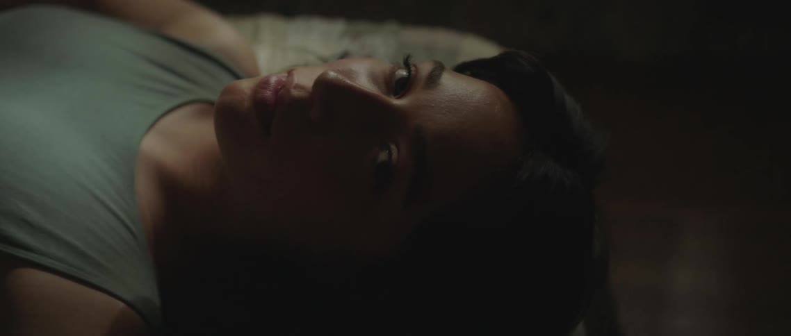 A woman laying in a bed resting