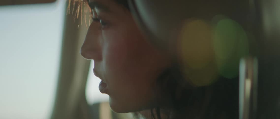 Close up of a teenage girl sitting in a vehicle