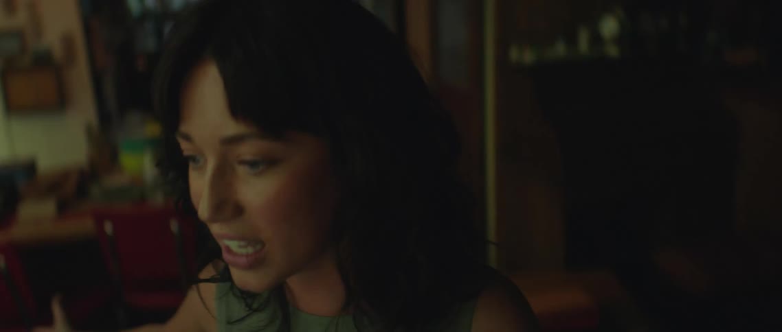 A woman is screaming at someone in the living room